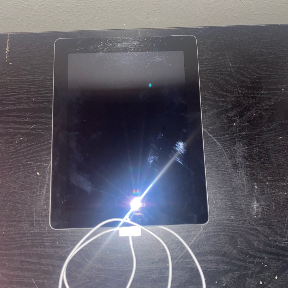Apple Black Tablet with White Charger
